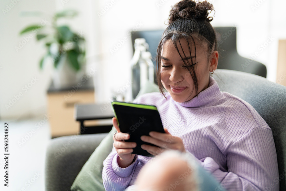Woman reading novel in electronic book Woman reading novel in electronic book