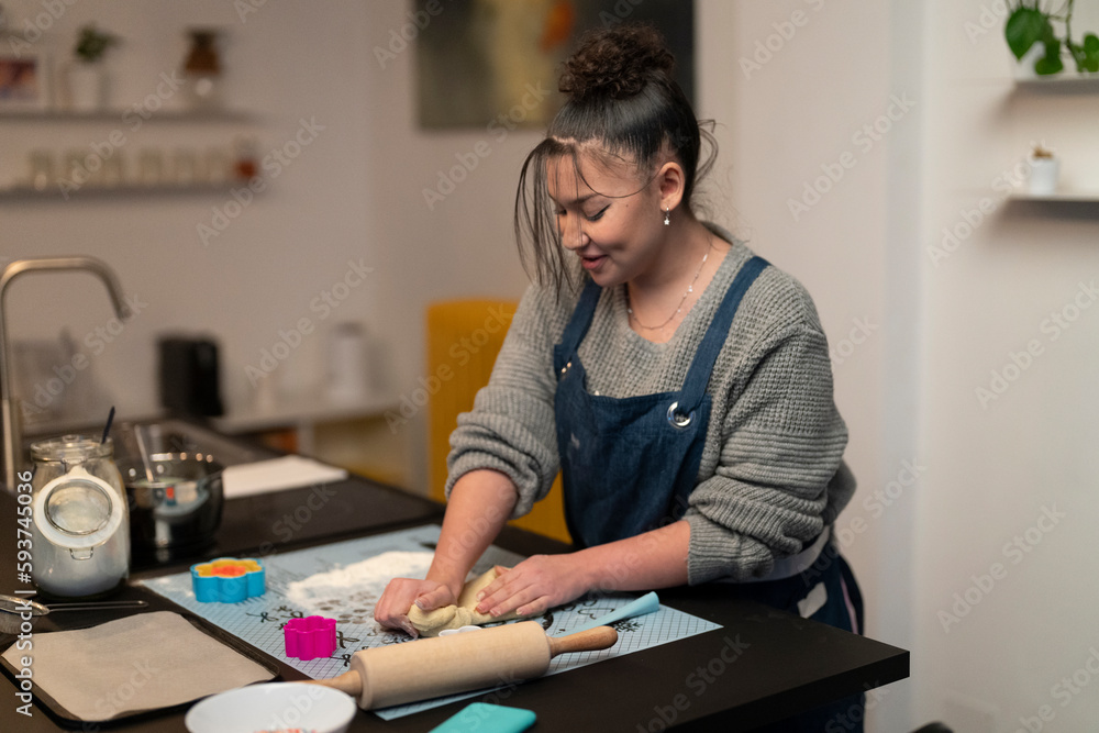 Woman making dough for cookies Woman making dough for cookies