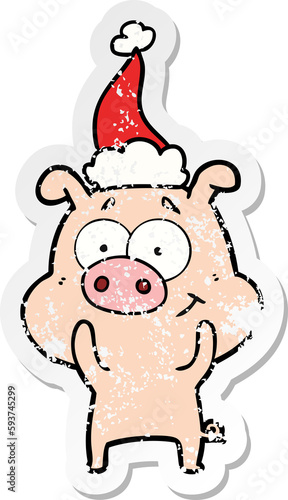 happy distressed sticker cartoon of a pig wearing santa hat