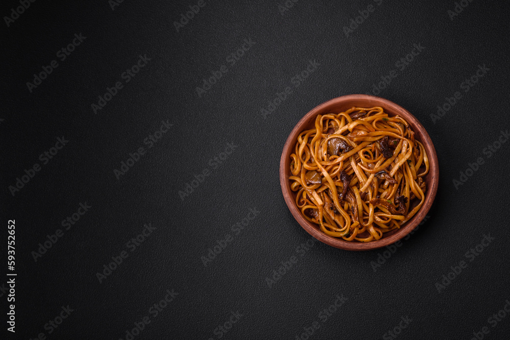 Delicious noodles or udon with mushrooms, salt, spices and herbs Delicious noodles or udon with mushrooms, salt, spices and herbs
