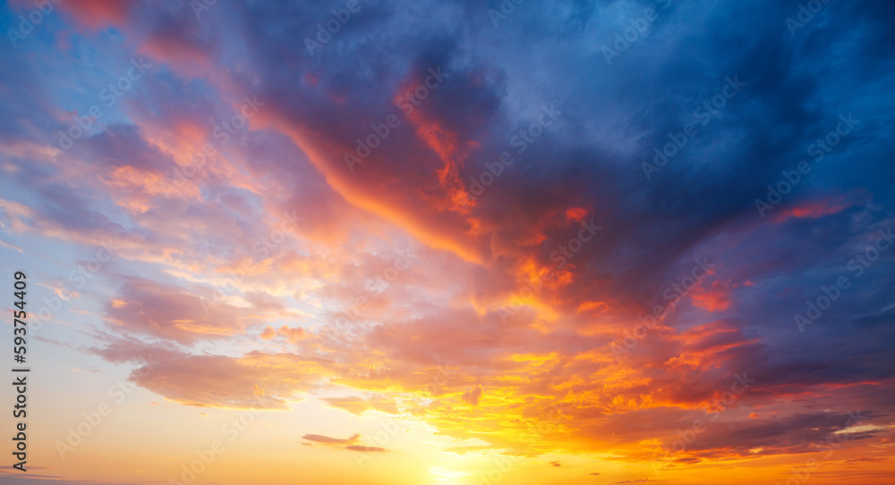 Utterly spectacular sunset with colorful clouds lit by the sun. Bright epic sky. - obrazy, fototapety, plakaty 