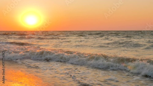 Sunset water shore sea sunrise beach sea summer beach morning sunrise over water sunrise summer shore waves lapping at shore sky. Vacation background. Foamy waves sun beach waves sunset sea background