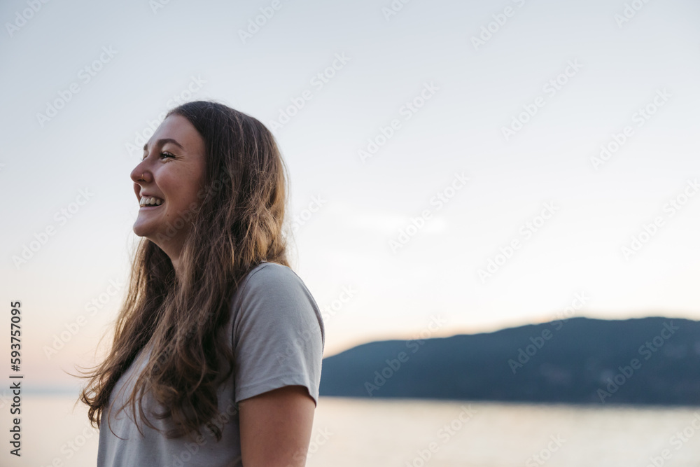 Smiling, happy young woman near the ocean water. Smiling, happy young woman near the ocean water.
