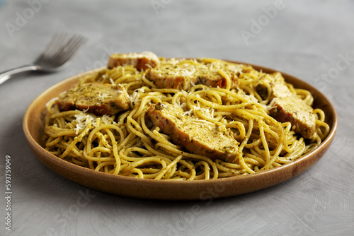 Homemade Pesto alla Genovese Pasta on a Plate, low angle view.