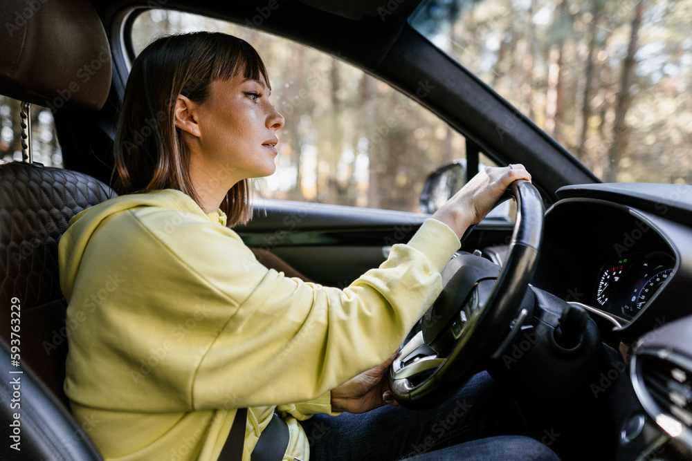 Woman driving a car Woman driving a car