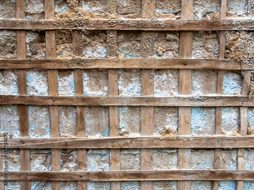Aged wooden grid on the wall. Old wooden texture.