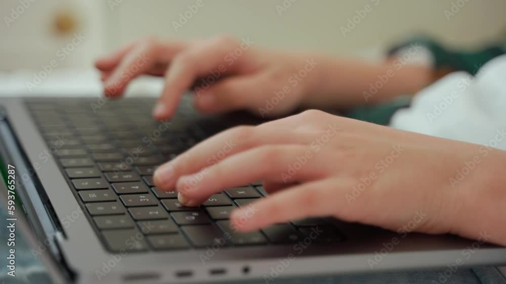 Close up smart caucasian middle School teenage using laptop green screen Chroma Key. Child typing on the keyboard. Side view Close up smart caucasian middle School teenage using laptop green screen Chroma Key. Child typing on the keyboard. Side view