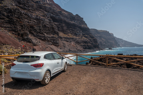White car in the parking lot on the Verodal beach on El Hierro Island. Canary Islands photo