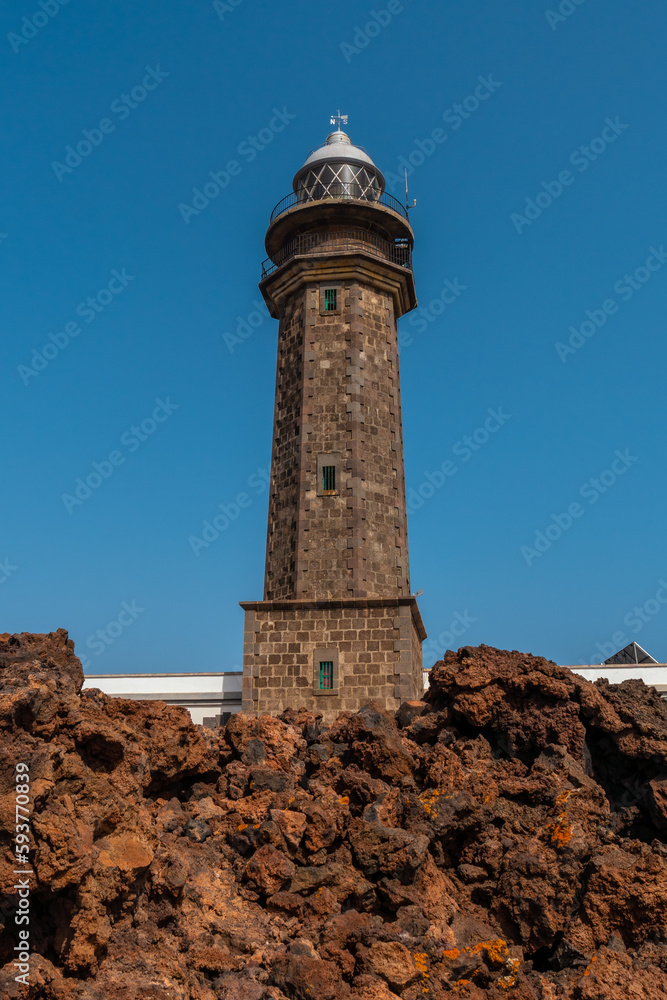 Beautiful Orchilla lighthouse with volcanic stones on the southwest coast of El Hierro. Canary Islands