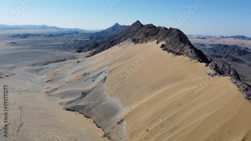 golden desert with high mountain in balochistan