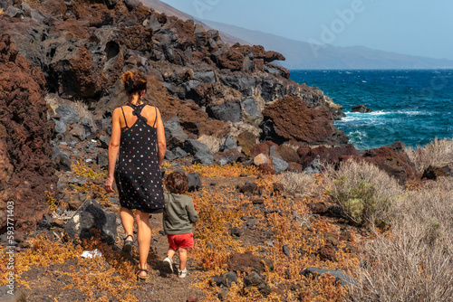 Mother and son on a footpath at the Muelle de Orchilla on the southwest coast of El Hierro. Canary Islands photo