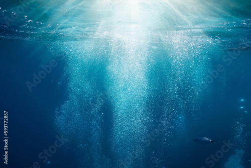 Fotografia Sunlight underwater with bubbles rising to water surface in the sea, Mediterrane