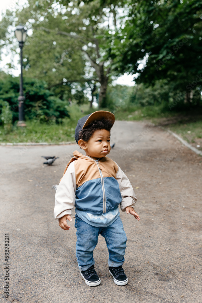 A little toddler boy walking around Central Park in NYC A little toddler boy walking around Central Park in NYC