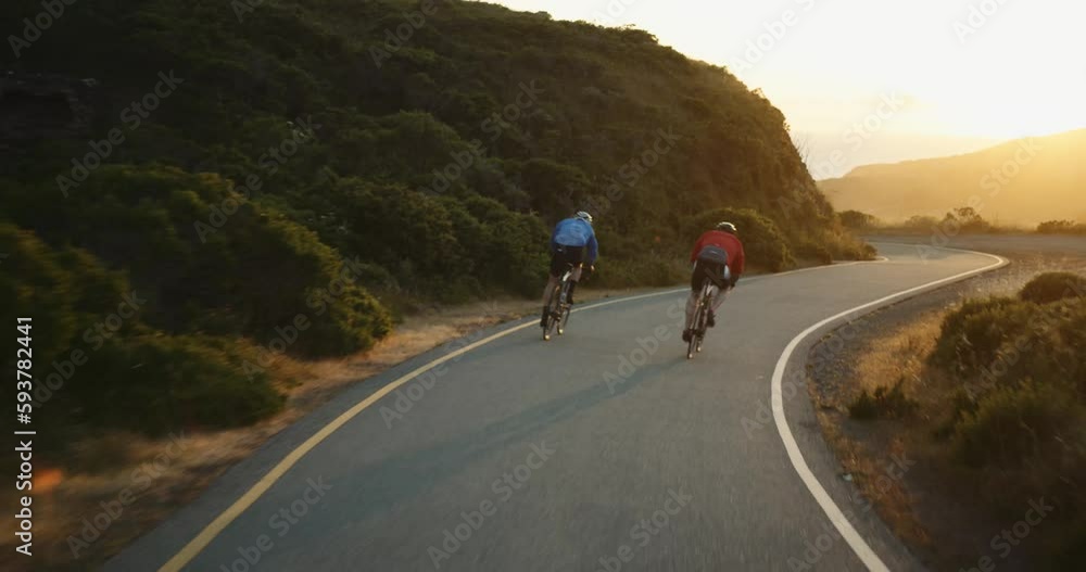 Cyclist Ride Down Sunny Mountain Road Cyclist Ride Down Sunny Mountain Road