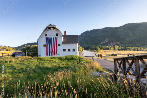 Park City Utah Barn farm summer  landscape with American Flag  photo