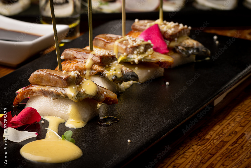 Delicious Japanese food made with fresh ingredients, sushi, fish, tuna and salmon. Delicious Japanese food made with fresh ingredients, sushi, fish, tuna and salmon.