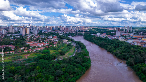 Aerial view of the city of Piracicaba, in Sao Paulo, Brazil. Piracicaba River with trees, houses and offices photo