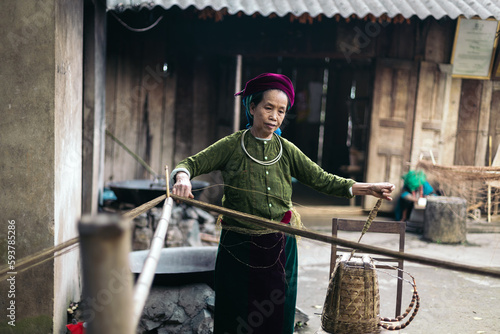 Hmong woman weaving in a workshop in the countryside in Ha Giang photo