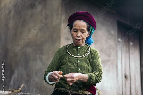 Hmong woman weaving in a workshop in the countryside in Ha Giang photo