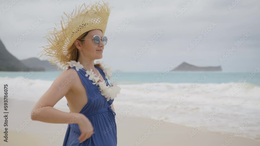 Portrait of Hula woman wearing a plumeria orchids lei. Happy smiling face of american woman tourist enjoying beautiful views of sunny summer beach on holidays, Hawaii Oahu, USA tourism 4K slow motion Portrait of Hula woman wearing a plumeria orchids lei. Happy smiling face of american woman tourist enjoying beautiful views of sunny summer beach on holidays, Hawaii Oahu, USA tourism 4K slow motion