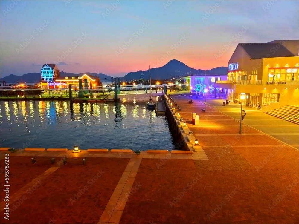 日本の長崎県の観光地、佐世保港のイルミネーションの電飾が美しい夕方の風景（コピースペースあり）