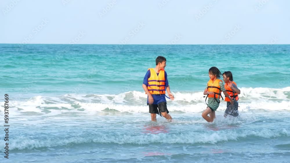Children playing on beach of sea in summer holiday of vacation time Children playing on beach of sea in summer holiday of vacation time