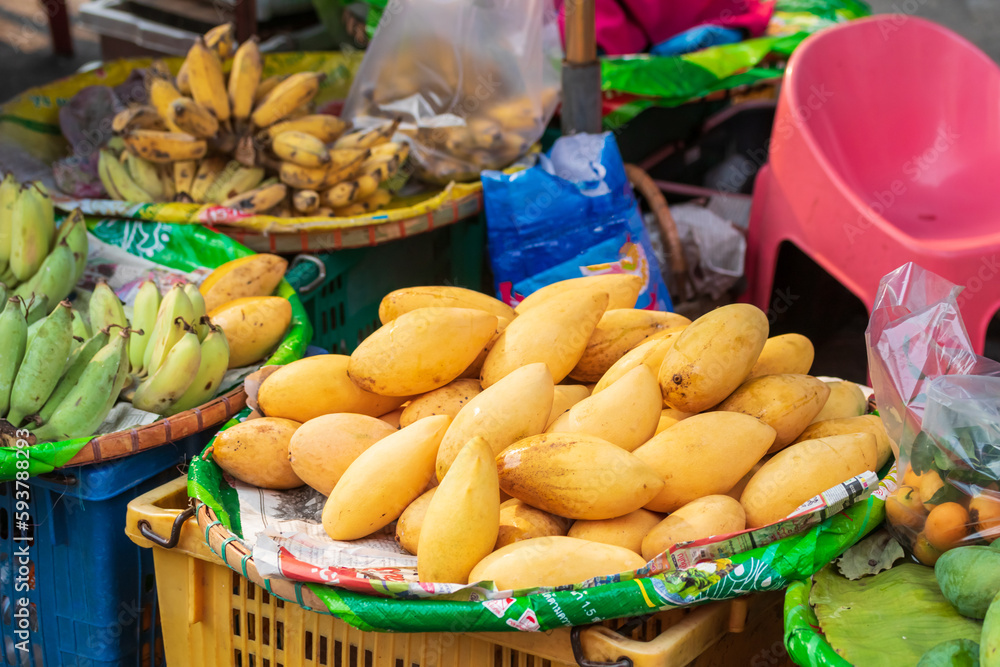 Heap of fresh ripe yellow mangoes at market for sell in Thailand