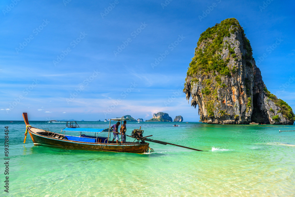 Long tail boats and cliff rock in azure water, Ko Rang Nok, Ao Phra Nang Beach, Ao Nang, Krabi, Thailand