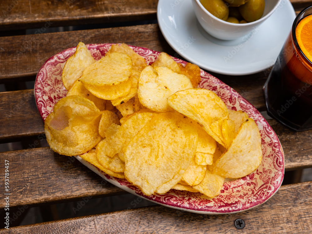 Traditional spanish appetizer Vermouth with chips closeup