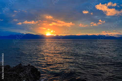 The golden radiant sunrise is on top of the mountain and on the scenic bay, vast sea.Liuqiu,Taiwan.for branding,calender,postcard,screensave,wallpaper,poster,banner,cover,website.High quality photo photo