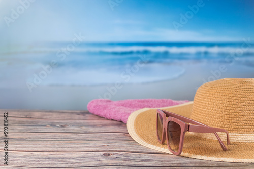 Women's beach accessories, with out-of-focus background, vacation concept.