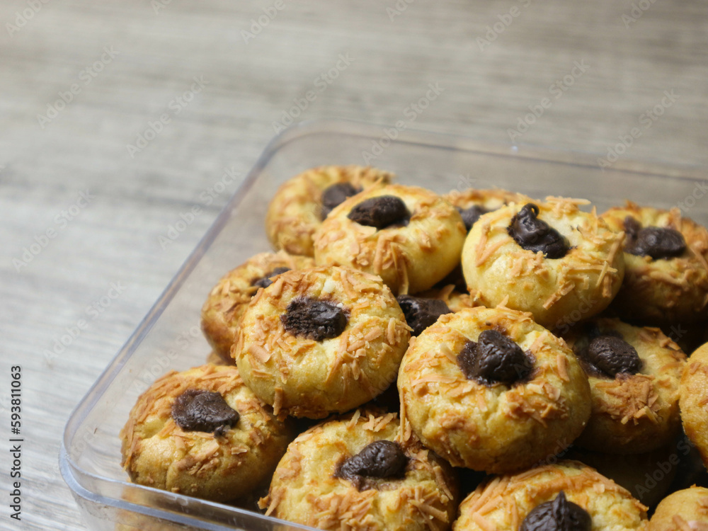 Cheese Thumbprint Cookies with Chocolate Filling on the plastic jar