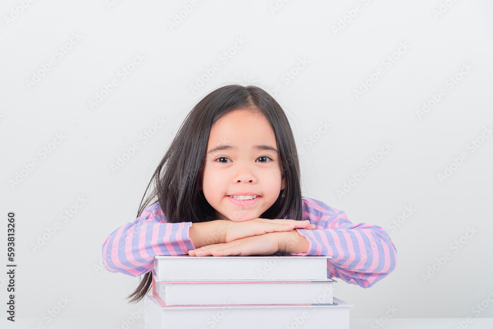 education and school concept - little student girl reading book education and school concept - little student girl reading book