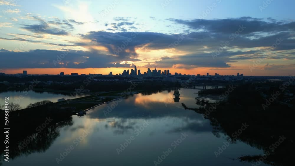 Panoramic shot of the Vistula River and the skyline of modern Warsaw from a rising drone Panoramic shot of the Vistula River and the skyline of modern Warsaw from a rising drone