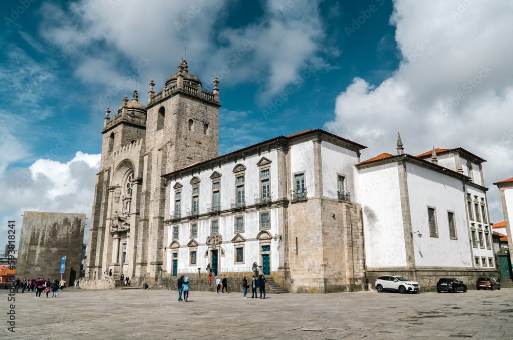 Oporto, Portugal. April 12 , 2022: Pelourinho and Porto Cathedral with facade and blue sky.