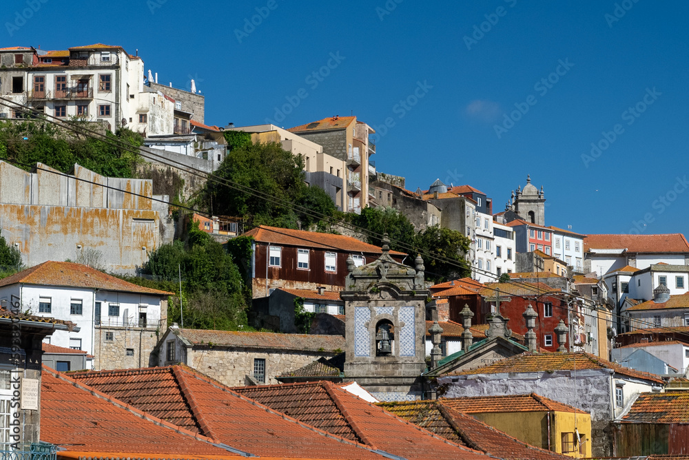 Oporto, Portugal. April 13 , 2022: Alfandega neighborhood in front of the duero houses with architecture facades.