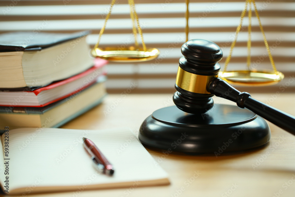 Lawyer or judge's hammer in the court. Auction's hammer and judgement golden scale are on wood table. Law subject. Judgement subject to judge people. Lawyer or judge's hammer in the court. Auction's hammer and judgement golden scale are on wood table. Law subject. Judgement subject to judge people.
