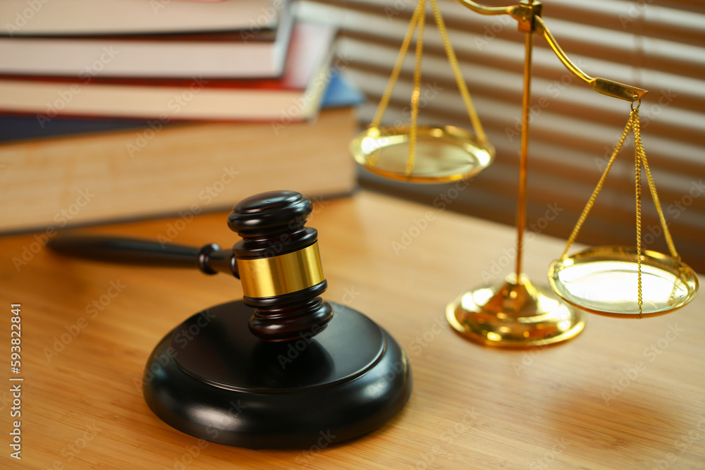 Lawyer or judge's hammer in the court. Auction's hammer and judgement golden scale are on wood table. Law subject. Judgement subject to judge people. Lawyer or judge's hammer in the court. Auction's hammer and judgement golden scale are on wood table. Law subject. Judgement subject to judge people.