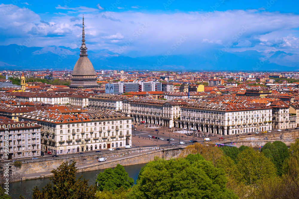 Torino city skyline in vibrant spring colors, with the view of Mole Antonelliana over the Po River and Ginzburg Park, a view from Church of Santa Maria del Monte dei Cappucciniin Turin, northern Italy