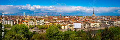 Torino city skyline with the view of Mole Antonelliana over the Po River and Ginzburg Park, a view from Church of Santa Maria del Monte dei Cappucciniin Turin, northern Italy