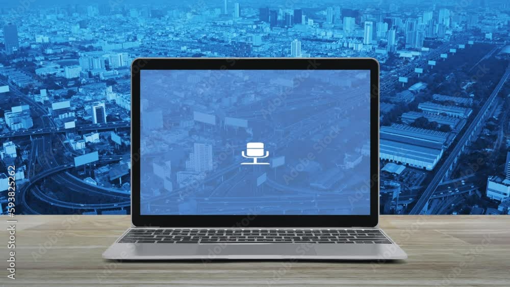 Microphone flat icon on modern laptop computer screen on wooden table over city tower, street, expressway and skyscraper, Business communication online concept