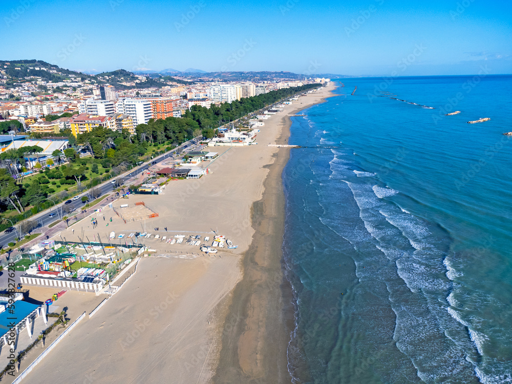 Aerial view landscape Italy Pescara. Long empty beach, sand, sea. Coast, promenade, buildings, estate.