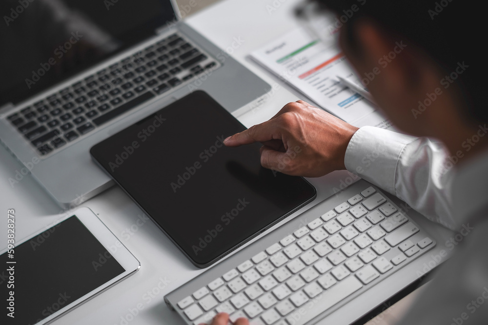 Close up of business man hand using tablet. business and technology concept Close up of business man hand using tablet. business and technology concept