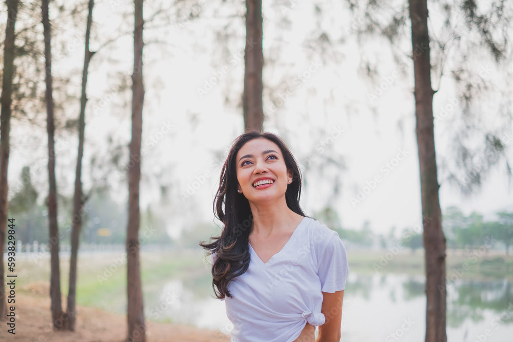 A concept of smiling female happy with life having inspiration, confidence, freedom, deep breath fresh air, positive, wellbeing, dreaming, euphoria, carefree, joy, spirit, celebrate life. Clam happy A concept of smiling female happy with life having inspiration, confidence, freedom, deep breath fresh air, positive, wellbeing, dreaming, euphoria, carefree, joy, spirit, celebrate life. Clam happy