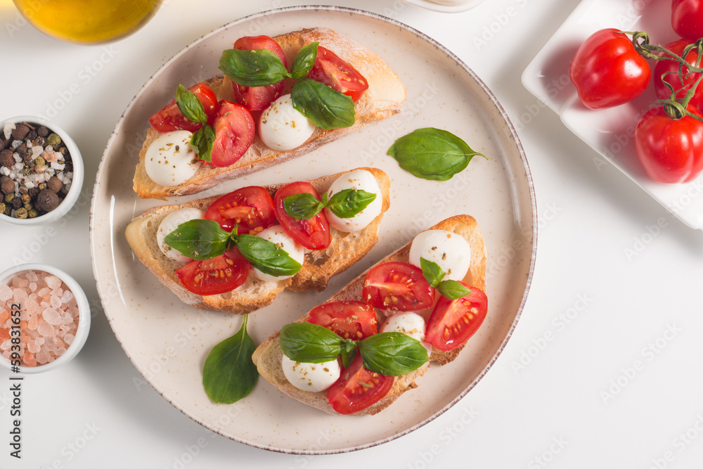 Tomato, basil and mozzarella cheese fresh made caprese bruschetta. Italian tapas, antipasti with vegetables, herbs and oil on grilled ciabatta and baguette bread. Open sandwich. Tomato, basil and mozzarella cheese fresh made caprese bruschetta. Italian tapas, antipasti with vegetables, herbs and oil on grilled ciabatta and baguette bread. Open sandwich.
