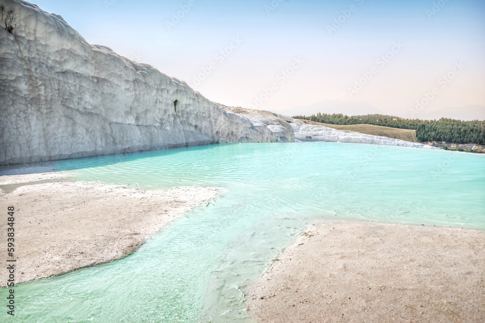 Small emerald travertine lakes and water streams of the White Mountain, Pamukkale, Turkey