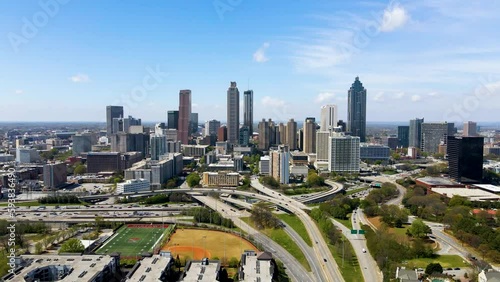 aerial drone footage of Atlanta Georgia downtown metropolis  area. the skyline is vibrant blue show casing the beautiful metropolises. related to urban travel, and architecture 