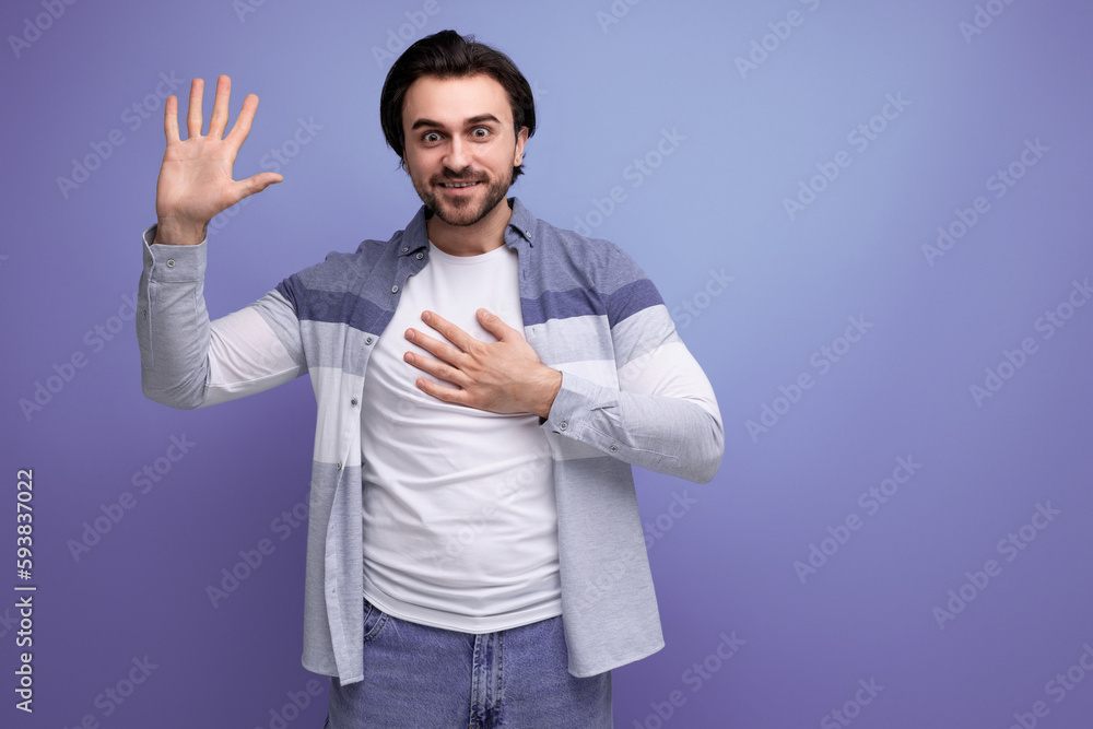 sympathetic young brunette man on studio background sympathetic young brunette man on studio background