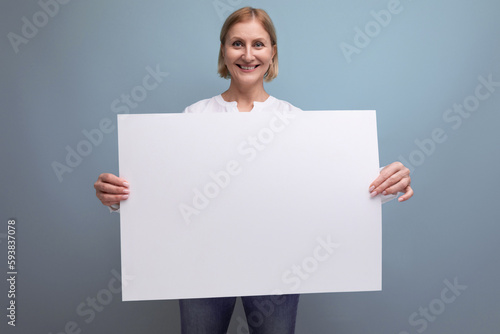 mature woman holding white paper poster with note mockup