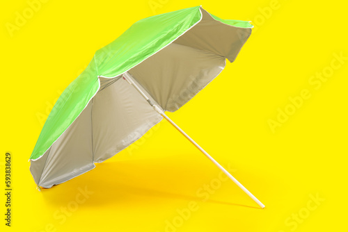 Bright green beach umbrella...